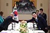 Korean President Yoon Suk Yeol, right, shakes hands with International Olympic Committee President Thomas Bach in New York on Tuesday, on the sidelines of the UN General Assembly. [JOINT PRESS CORPS]