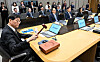 Bank of Korea Gov. Rhee Chang-yong, left, bangs the gavel to open a Monetary Policy Committee meeting at the central bank in Seoul, in this file photo from Oct. 23. [YONHAP]