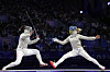 Korea's Jeon Ha-young, left, competes with Ukraine's Olga Kharlan in the women's team sabre final at the Grand Palais in Paris on Saturday.  [AP/YONHAP]
