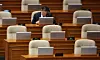 Minister of Justice Jung Sung-ho is seen listening to a filibuster at the National Assembly after a revision to the Commercial Act to mandate the retirement of treasury shares was tabled at the plenary session, at the National Assembly in Yeouido, western Seoul, on Feb. 25. [YONHAP]