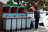 An apartment security guard is seen organizing recycling bins on the grounds of an apartment complex in Seoul on Oct. 21, 2021. [NEWS1]
