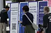 Customers wait to get their SIM cards replaced at an SK Telecom store inside the Gimpo International Airport on May 9. [NEWS1]