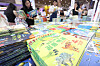 Parents look through children's books at a book fair held in Coex, southern Seoul, on July 10. [YONHAP]