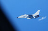This handout photo taken on July 9 and received on July 11 from Japan's Ministry of Defense shows a Chinese JH-7 fighter-bomber flying close to a Japan Air Self-Defense Force YS-11EB intelligence-gathering aircraft on surveillance over the high seas in the East China Sea. [AFP/YONHAP]