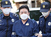 Ra Deok-yeon, head of an investment consulting firm, appears at the Seoul Southern District Court in southern Seoul on May 11, 2023, for a warrant hearing. [YONHAP]