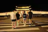 Runners make their way toward Gwanghwamun, illuminated by yellow light, to start their 8-kilometer run. [HAN STRIDE]
