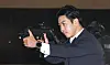 A Presidential Security Service agent demonstrates a shooting in a security demonstration event at the Presidential Security Training Center in Gangseo District, western Seoul, on May 27. [JOINT PRESS CORPS]