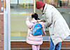 A child enters day care center in Seoul on Feb. 11. [NEWS1]