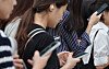 Commuting citizens look into their phones on a Seoul subway on Sept. 19. Often on public transportation, people reading posts not only on social media such as Instagram or TikTok but also on online community sites can be found. [YONHAP]