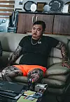Character Chorong, a secondhand car dealer featured in “The Roundup: No Way Out 3” has tattoos all over his body. [JOONGANG PHOTO]
