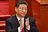 China's President Xi Jinping applauds during the opening session of the National People's Congress at the Great Hall of the People in Beijing on March 5. [APP/YONHAP]