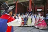 Visitors take pictures in the 2025 Spring K-Royal Culture Festival at the Gyeongbok Palace in Jongno District, central Seoul, on April 26, 2025. [KOREA HERITAGE AGENCY][KOREA HERITAGE AGENCY]