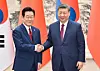 Korean President Lee Jae Myung, left, shakes hands with Chinese President Xi Jinping prior to their bilateral meeting at the Great Hall of the People, in Beijing, China, on Jan. 5. [XINHUA/YONHAP]