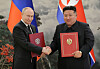 North Korean leader Kim Jong-un, right, shakes hands with Russian President Vladimir Putin in Pyongyang after signing a comprehensive strategic partnership treaty in June. [RODONG SINMUN]