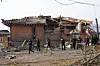 Investigators examine the site of an accidental fighter jet bombing over a village in Pocheon, some 40 kilometers north of Seoul, on March 7, 2025, one day after two Korean Air Force KF-16 fighter jets mistakenly released eight MK-82 air-to-surface bombs outside a training range, leaving 15 civilians and 14 soldiers injured. [YONHAP]