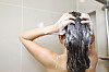 A woman washes her hair with shampoo. [CJ OLIVE YOUNG]