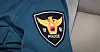 An officer wears the Korean police logo [YONHAP]