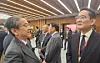 Samsung Electronics Executive Chairman Lee Jae-yong, right, talks to another attendee during the Trilateral Executive Dialogue held at the Keidanren Kaikan in Tokyo on Oct. 15. [YONHAP]
