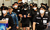 Koreans detained in Cambodia who were found during a crackdown on criminal compounds are deported through Terminal 2 of Incheon International Airport on Oct. 18. [NEWS1]