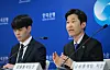 Kim Min-soo, left, head of the financial statistics team at the Bank of Korea (BOK), speaks during a press briefing held at BOK headquarters in central Seoul on Tuesday. [BOK]