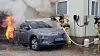 Firefighters douse flames erupting from a Hyundai Kona electric vehicle that burst into flames last July near an office in Gangneung, Gangwon. [GANGNEUNG FIRE DEPARTMENT]
