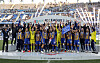 Ulsan Hyundai players celebrate winning the 2023 K League 1 title and raise the league trophy at Ulsan Munsu Football Stadium in Ulsan on Sunday. [NEWS1]