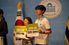 Children hold signs at a National Assembly press conference calling for stronger guarantees of their right to health in 2024. [GOOD NEIGHBORS]