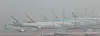 Korean Air Lines and Asiana Airlines carriers parked at the Incheon International Airport on Friday. [YONHAP]