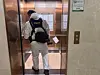 An investigator enters the apartment building in Songdo, Incheon, on July 21 where a father shot his son a day earlier. [NEWS1]
