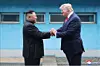 U.S. President Donald Trump, right, and North Korean leader Kim Jong-un hold hands during an encounter at the Panmunjom truce village along the inter-Korean border on June 30, 2019, in this photo carried by the state-run Korean Central News Agency. [YONHAP]