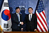 Jeong Yeon-doo, vice minister for diplomatic strategy and intelligence at the Foreign Ministry, right, and Kevin Kim, charge d'affaires ad interim at the U.S. Embassy in Seoul, shake hands before a joint discussion at the Foreign Ministry building in Jongno District, central Seoul, on Dec. 16. [JOINT PRESS CORPS]