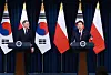 President Yoon Suk Yeol, right, and Polish President Andrzej Duda take part in a joint press conference after their bilateral summit at the Yongsan presidential office in central Seoul on Thursday. [JOINT PRESS CORPS]