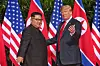 U.S. President-elect Donald Trump, right, and North Korean leader Kim Jong-un meet at their first summit in Singapore on June 12, 2018. The summit marks the first meeting between an incumbent U.S. President and a North Korean leader. [EPA/YONHAP]