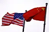 Chinese and U.S. flags flutter outside the building of an American company in Beijing, China on April 8. [REUTERS/YONHAP]