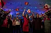 Supporters of the ruling Inuit Ataqatigiit party react during the general election in Nuuk, Greenland, on March 11. [REUTERS/YONHAP]