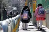 Students leave an elementary school in Seoul on Feb. 13. [NEWS1]