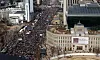 Supporters of President Yoon Suk Yeol wave Korean and American flags at a rally in Gwanghwamun Square in downtown Seoul. [NEWS1]