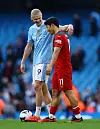 Manchester City's Erling Haaland talks to Wolverhampton Wanderers' Hwang Hee-chan after a game at the Etihad Stadium in Manchester on Saturday. [REUTERS/YONHAP]
