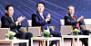 Korean President Yoon Suk Yeol, center, Japanese Prime Minister Fumio Kishida, left, and Chinese Premier Li Qiang, right, clap at the 8th South Korea-Japan-China Business Summit at the Korea Chamber of Commerce and Industry in central Seoul on Monday, after their trilateral summit. [JOINT PRESS CORPS]