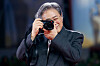 Director Park Chan-wook holds up a camera on the red carpet for the screening of the movie ″No Other Choice,″ in competition at the 82nd Venice International Film Festival, Venice, Italy, Aug. 29. [REUTERS/YONHAP]