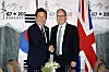 President Lee Jae Myung, left, shakes hands with British Prime Minister Keir Starmer at the G7 summit in Kananaskis, Alberta, in Canada on June 17. [JOINT PRESS CORPS]
