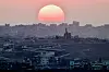 The sun sets over north Gaza on July 28. [REUTERS/YONHAP]