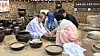 Visitors make Andong soju with Kim Yeon-bak and his wife Bae Kyung-hwa at the Andong Soju Museum.[WOO JI-WON]