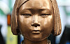 A statue of a girl symbolizing the victims of Japanese wartime sexual slavery, euphemistically called ″comfort women,″ is seen in front of the grounds of the former Japanese embassy to Korea in central Seoul on Dec. 28, 2025. [YONHAP]