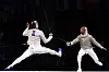 Korea's Oh Sang-uk, left, and Tunisia's Fares Ferjani compete in the men's sabre individual gold medal bout during the Paris 2024 Olympics at the Grand Palais in Paris on Saturday. [AFP/YONHAP]