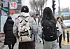 Young people walk down a street in Noryangjin, Dongjak District, southern Seoul, on Feb. 16. [YONHAP]