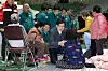 People Power Party floor leader Kweon Seong-dong, center, holds hands with a woman displaced by ongoing wildfires at a shelter in Andong, North Gyeongsang, on March 27. [NEWS1]
