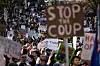 Protesters hold up signs during the nationwide ″Hands Off!″ protest against US President Donald Trump and his advisor, Tesla CEO Elon Musk, in downtown Los Angeles on April 5. [AP/YONHAP]