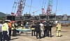 Firefighters at the scene wait for a structure to be lifted by crane to carry out rescue operations. In May 2024, two workers at a shipbuilding company in South Gyeongsang died after being crushed under a ship structure. [GYEONGSANGNAM-DO FIRE DEPARTMENT]