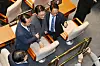 Prime minister nominee Kim Min-seok poses for a commemorative photo with Democratic Party Rep. Park Sun-won and others in the National Assembly’s main chamber on June 26, where President Lee Jae Myung delivered a policy speech on the supplementary budget. [JOINT PRESS CORPS]